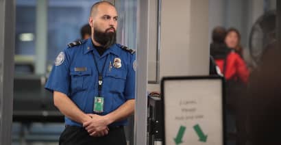 TSA's airport screeners  get partial pay as shutdown's financial toll worsens