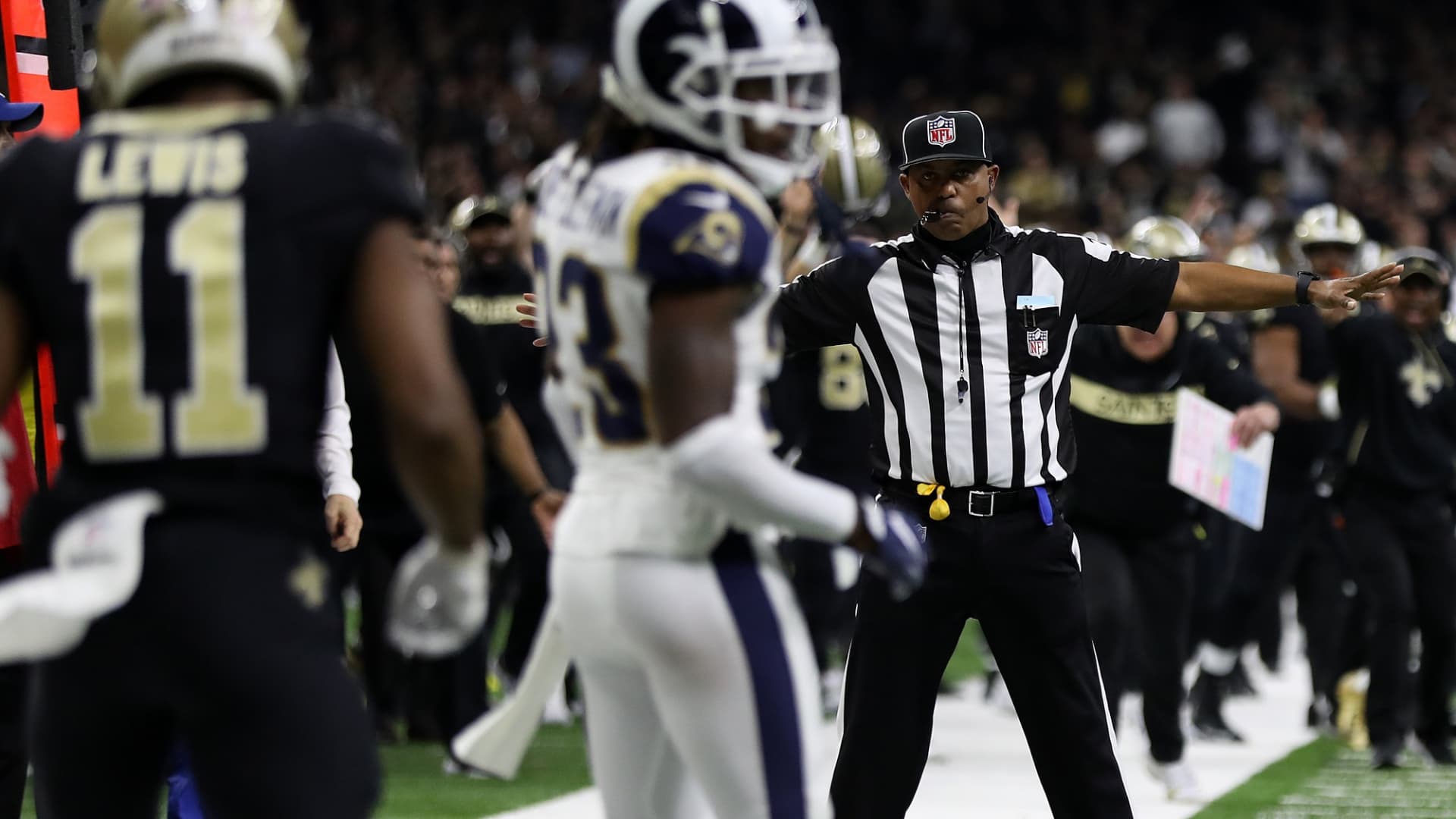 A referee watches as Tommylee Lewis #11 of the New Orleans Saints drops a pass broken up by Nickell Robey-Coleman #23 of the Los Angeles Rams during the fourth quarter in the NFC Championship game at the Mercedes-Benz Superdome on January 20, 2019 in New Orleans, Louisiana. at Mercedes-Benz Superdome on January 20, 2019 in New Orleans, Louisiana.