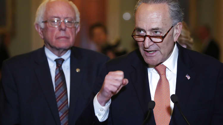 Watch four experts debate Schumer and Sanders' plan to limit stock buybacks