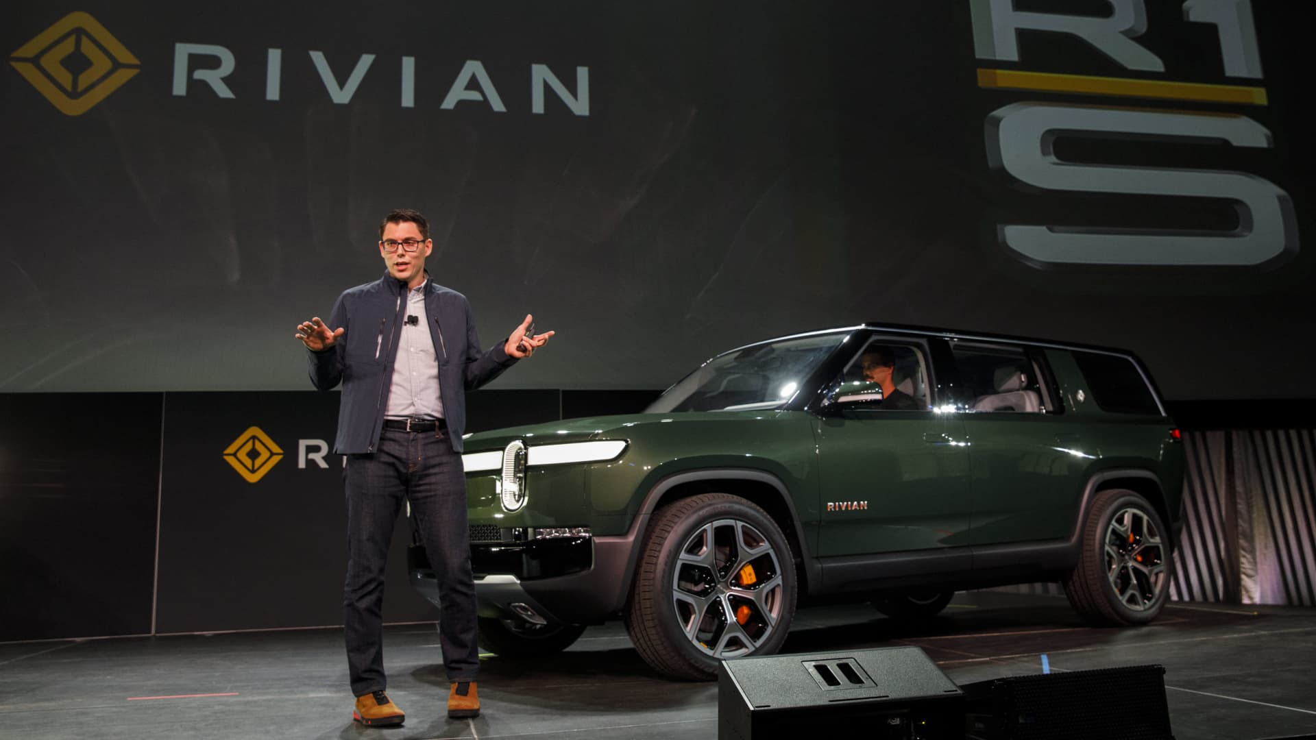 RJ Scaringe, founder and chief executive officer of Rivian Automotive, speaks after unveiling the R1S electric sports utility vehicle (SUV).