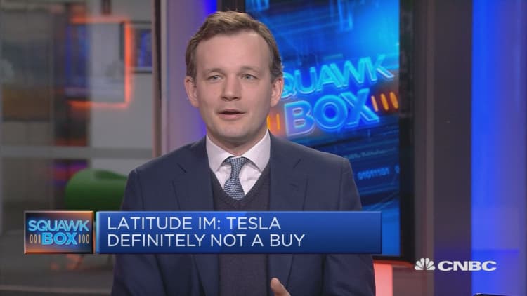 Tesla will likely get bought by a tech company, analyst says