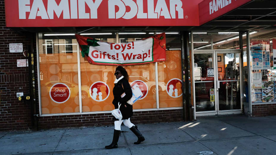 A woman walks by a Family Dollar store on December 11, 2018 in the Brooklyn borough of New York City.