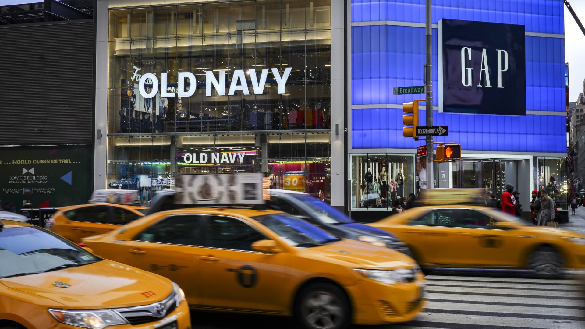 Traffic passes by an Old Navy and GAP stores in Times Square, March 1, 2019 in New York City.