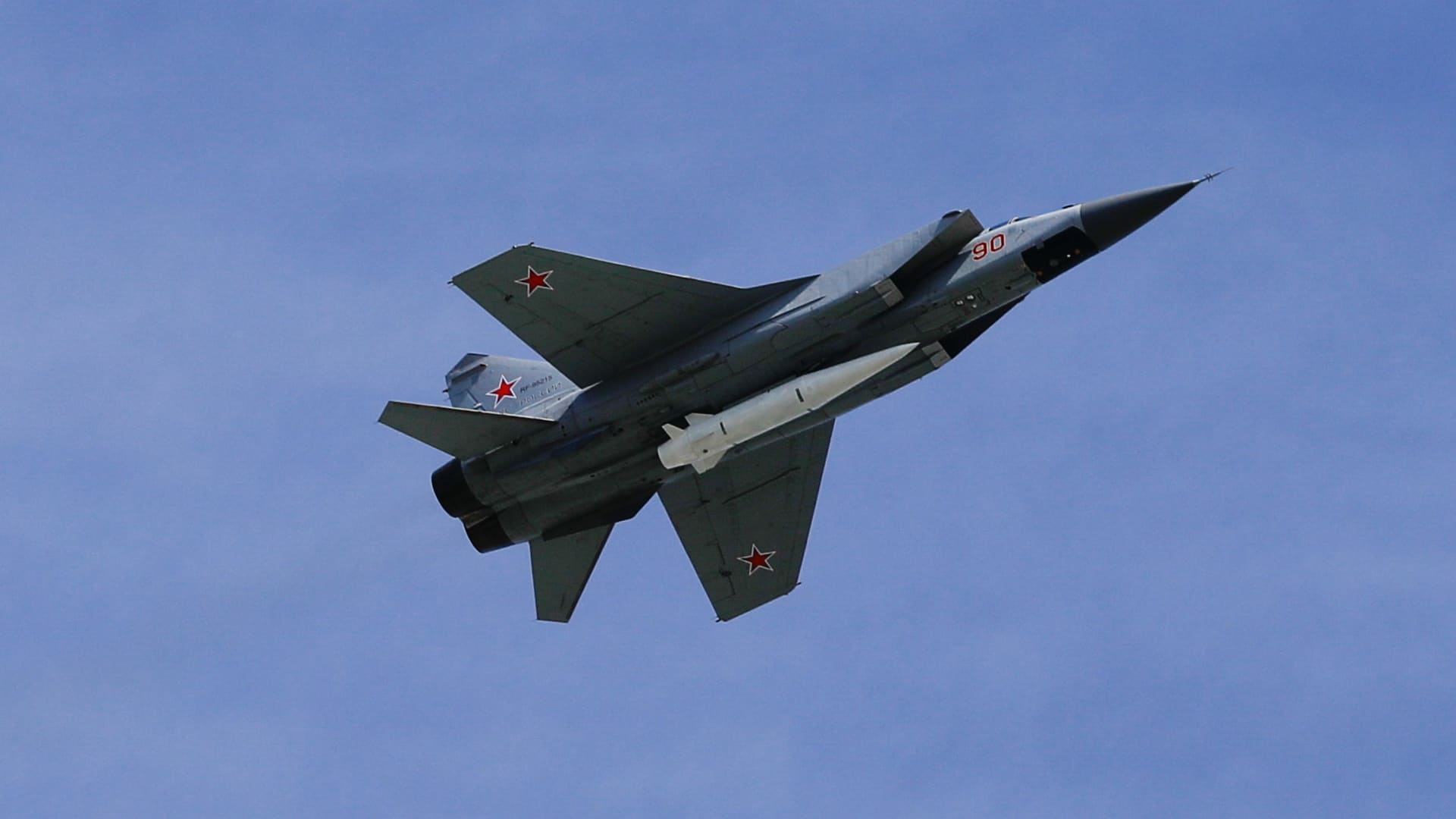 A MiG-31K fighter jets with Kinzhal hypersonic missiles fly over Moscow's Red Square during the Victory Day military.
