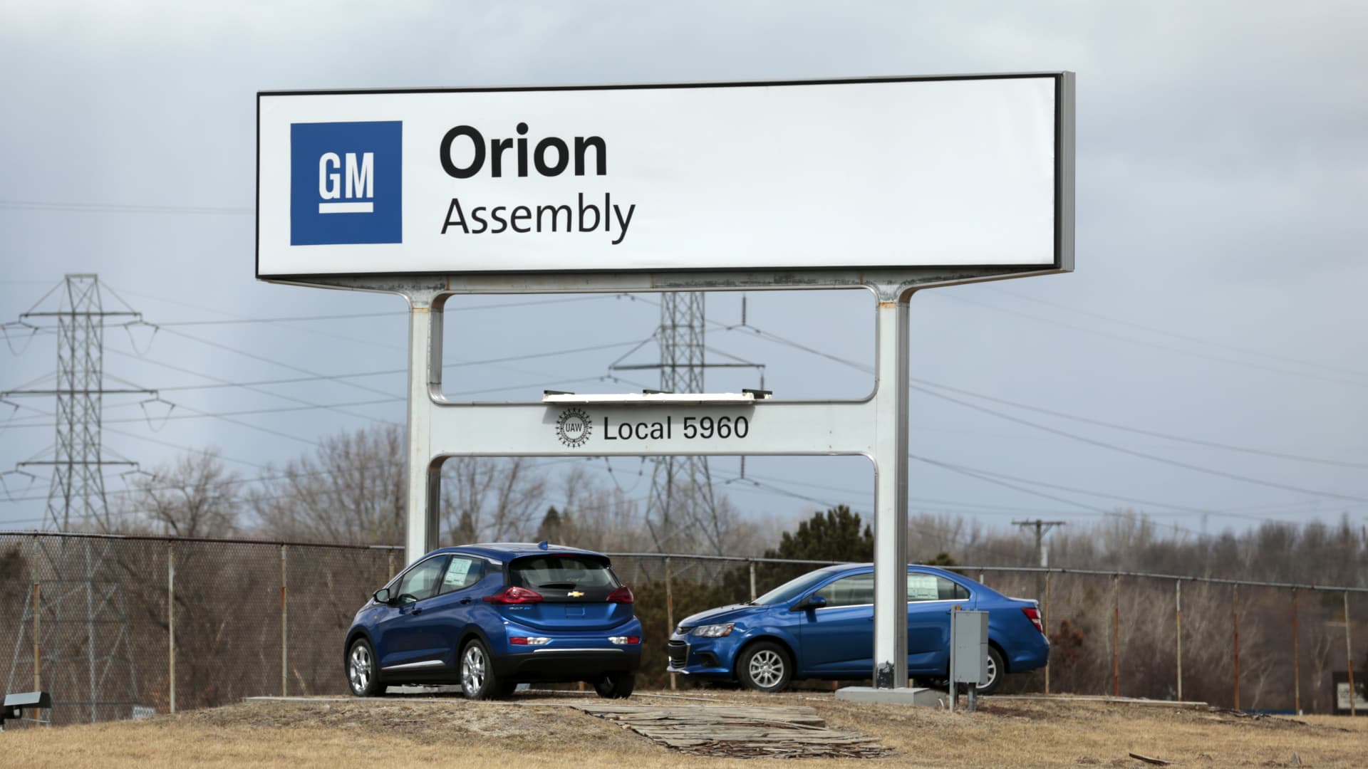 Signage stands on display outside the General Motors Co. Orion Assembly plant in Orion Township, Michigan, U.S., on Friday, March 22, 2019.