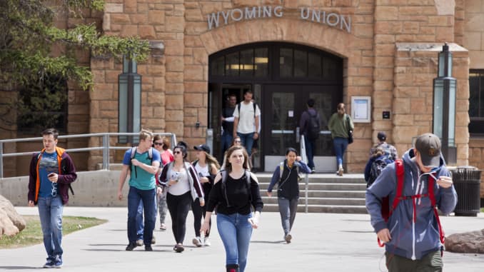 Students walk across campus between classes at the University of Wyoming, on April 30, 2018 in Laramie, Wyoming.