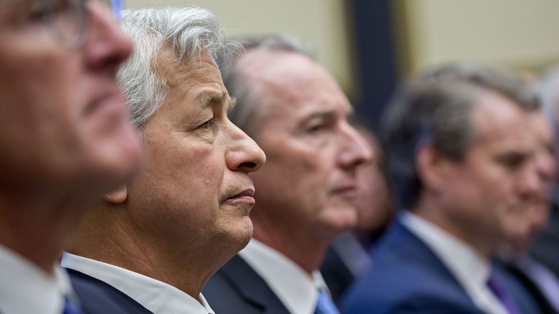 Jamie Dimon, chief executive officer of JPMorgan Chase & Co., second left, listens during a House Financial Services Committee hearing in Washington, D.C., U.S., on Wednesday, April 10, 2019.
