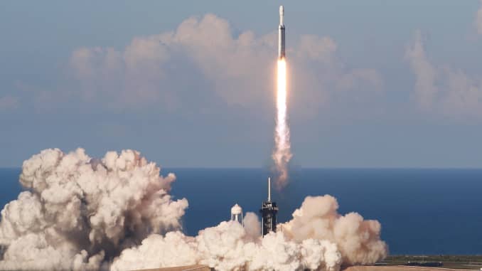 A SpaceX Falcon Heavy rocket, carrying the Arabsat 6A communications satellite, lifts off from the Kennedy Space Center in Cape Canaveral, Florida, April 11, 2019.