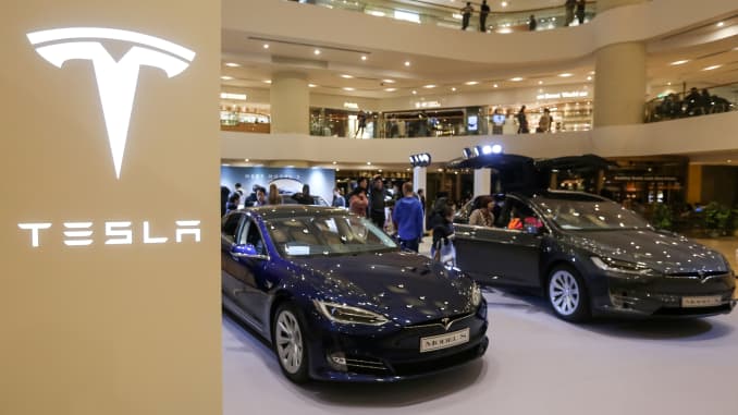 A Tesla Model S (L) and Model X are displayed at a shopping mall in Hong Kong on March 10, 2019.