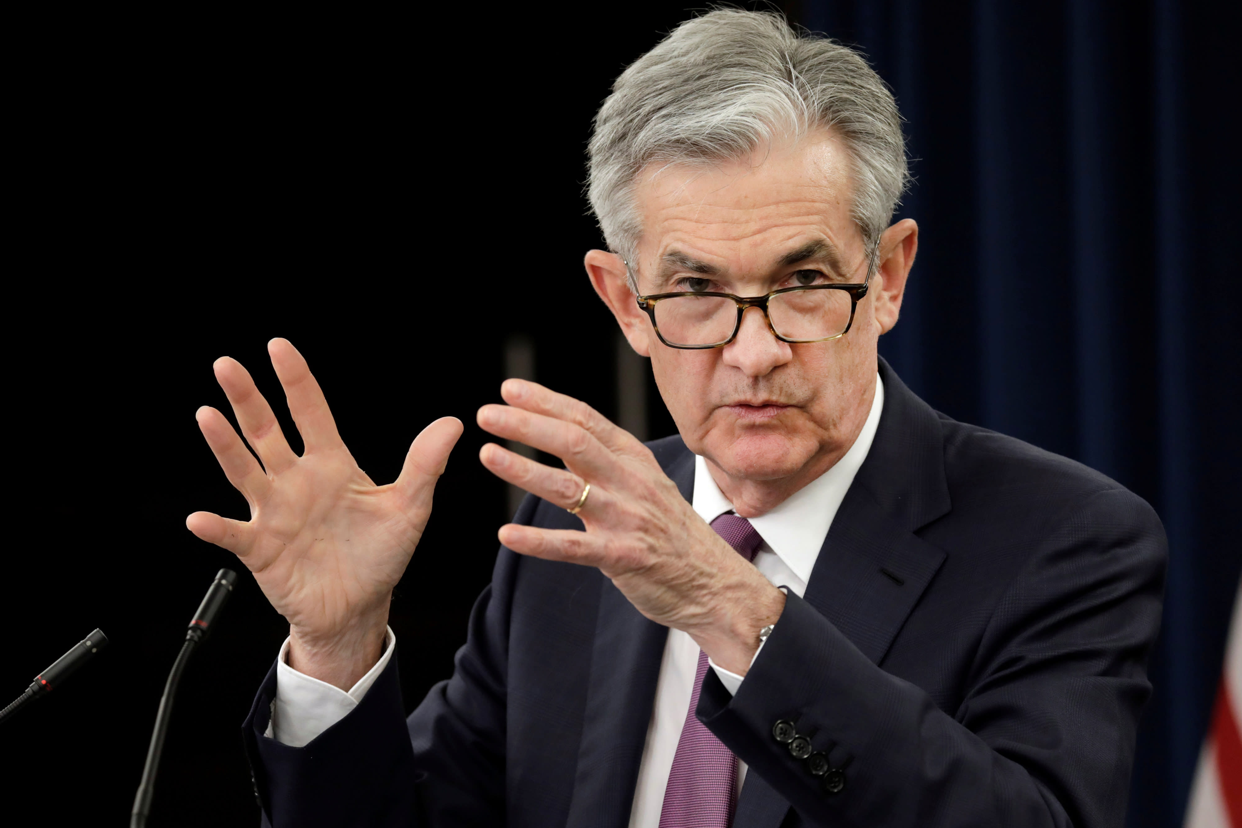 Fed will aggressively dial back its monthly bond buying, sees three rate hikes next year