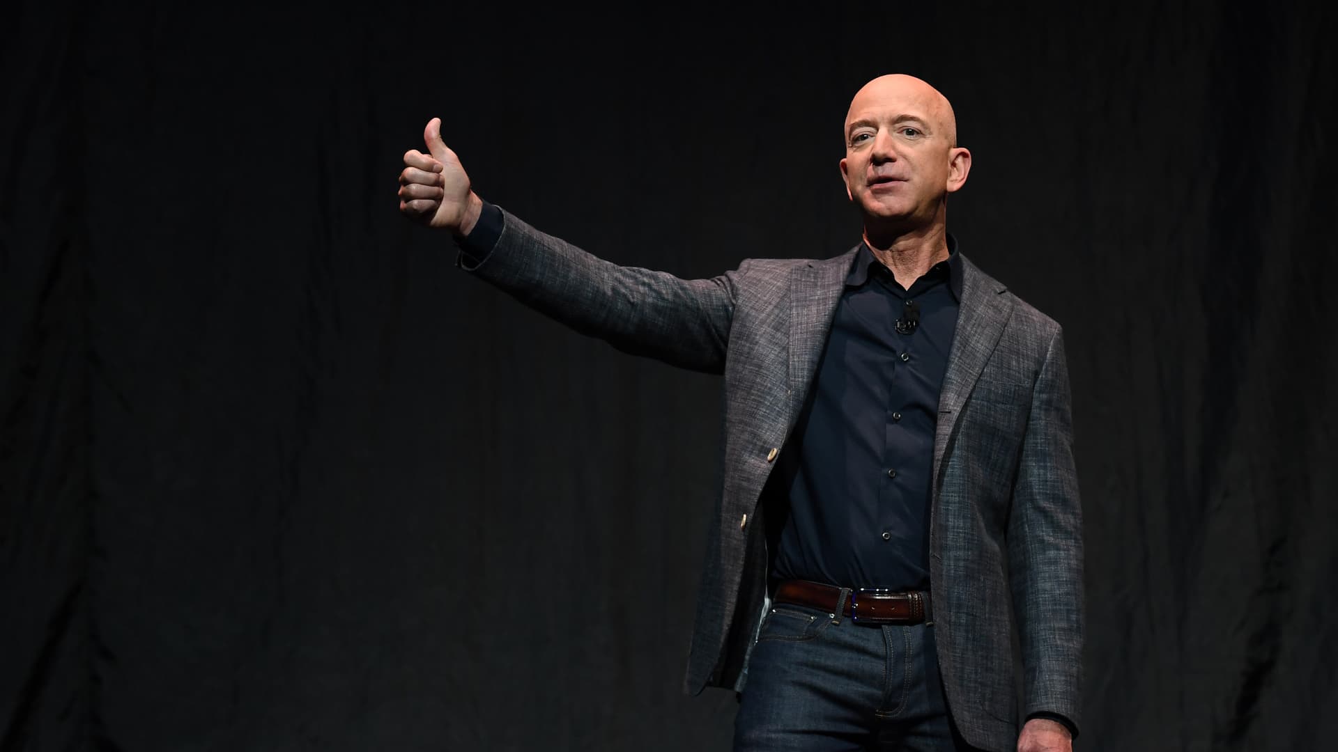 Jeff Bezos gives a thumbs-up as he speaks during an event about Blue Origin's space exploration plans in Washington, D.C., May 9, 2019.