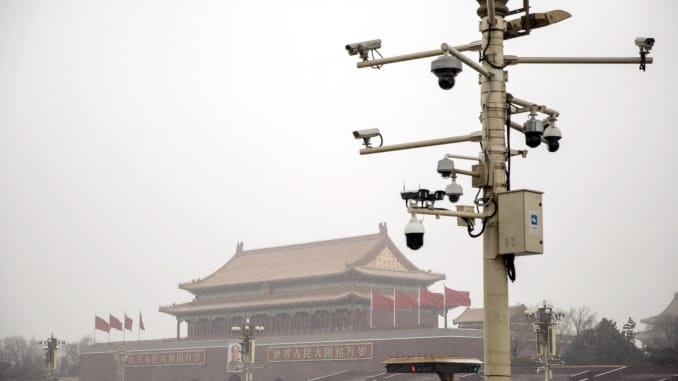 Surveillance cameras are mounted on a post at Tiananmen Square as snow falls in Beijing, China, on Thursday, Feb. 14, 2019.