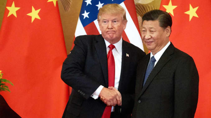 President Donald Trump and China's President Xi Jinping shake hands at a press conference following their meeting at the Great Hall of the People in Beijing.