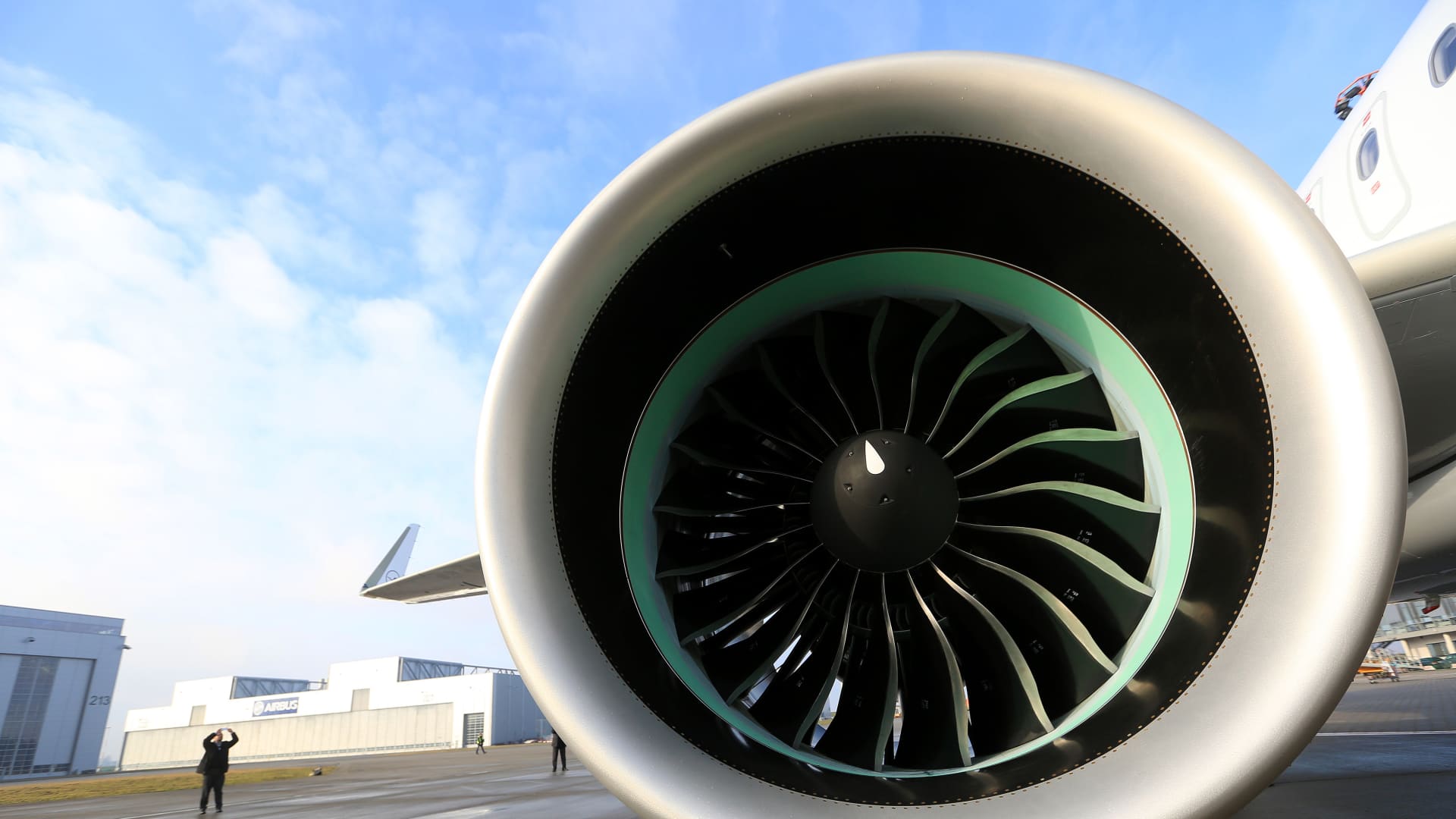 A Pratt & Whitney PW1000G turbofan engine sits on the wing of an Airbus A320neo aircraft during a delivery ceremony outside the Airbus Group SE factory in Hamburg, Germany, on Friday, Feb. 12, 2016.