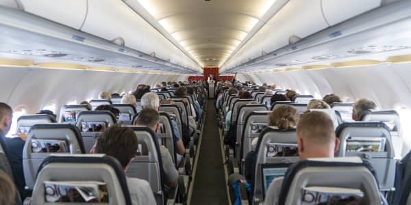 Why do airlines overbook flights?