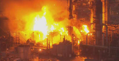 Watch a fire engulf part of the East Coast's largest oil refinery after an explosion