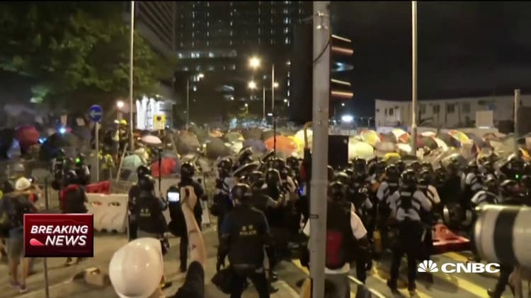 Hong Kong protesters confront riot police