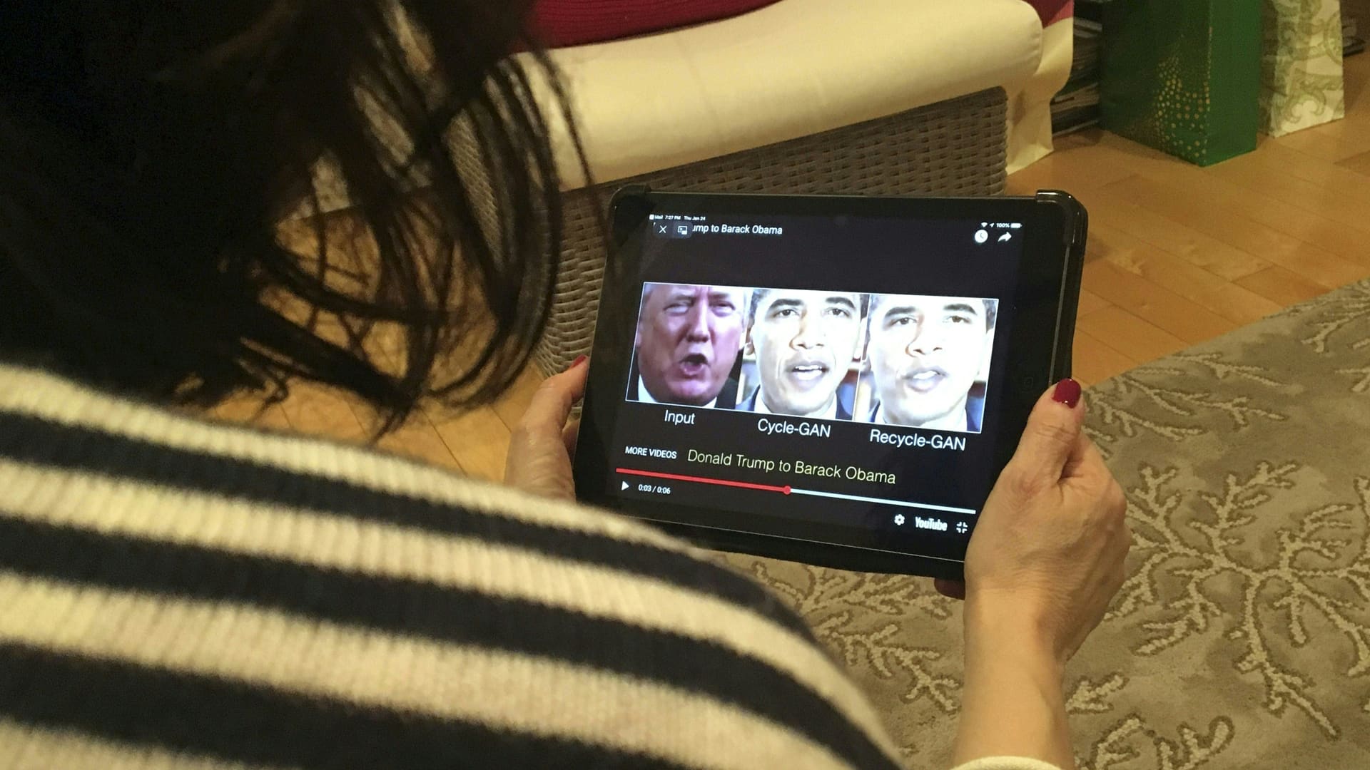 A woman views a manipulated video of President Donald Trump and former president Barack Obama, illustrating how deepfake technology can deceive viewers.