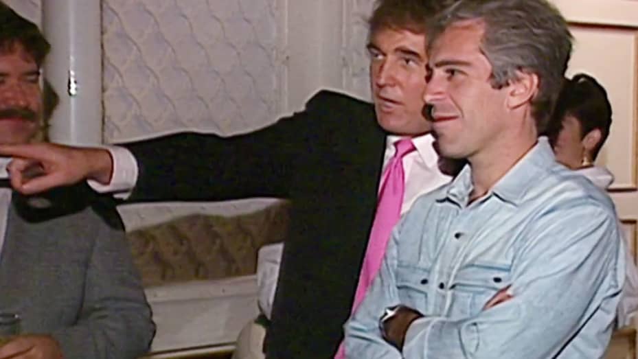 A video still from the NBC archive showing Donald Trump talking with Jeffrey Epstein at a party in Mar-A-Lago from 1992.