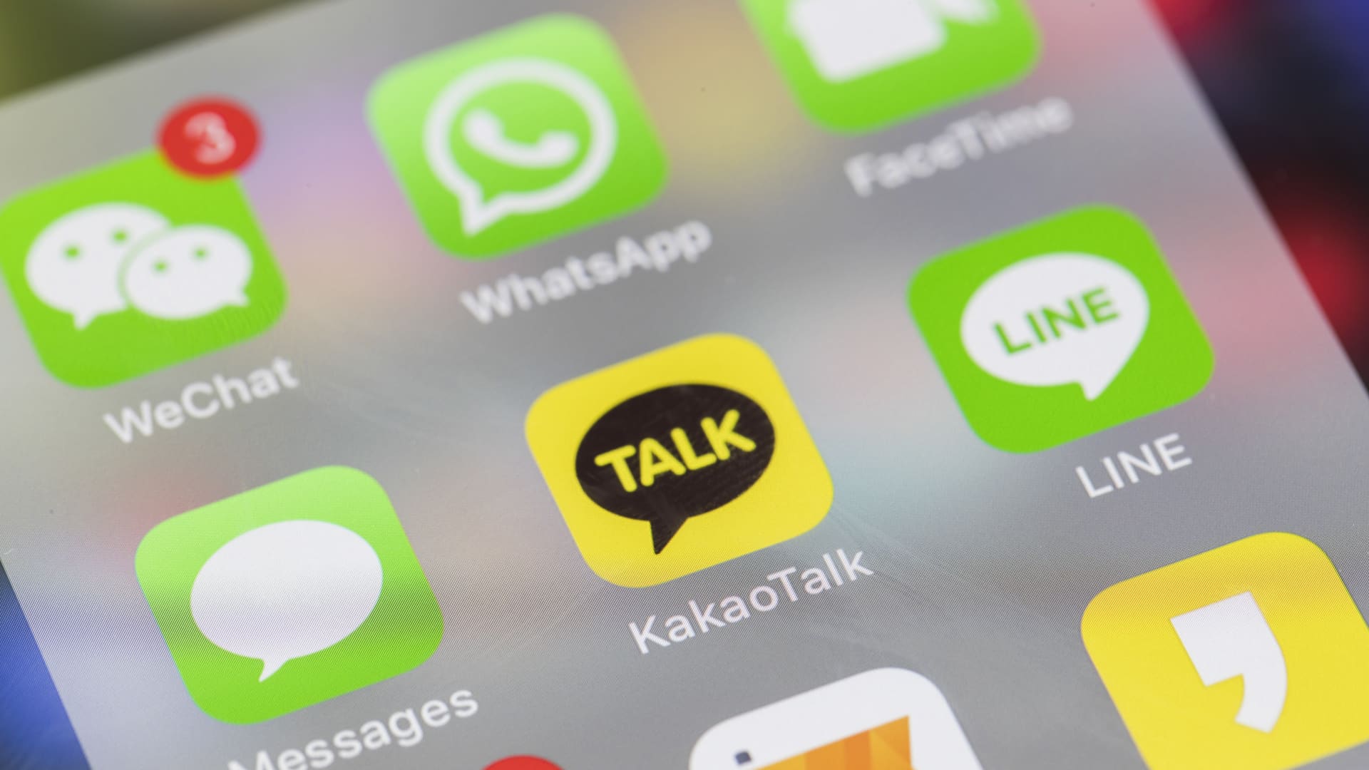 A smart phone with the icons for the social networking apps KakaoTalk, WeChat, Line, WhatsApp, FaceTime, and others are seen on the screen in Hong Kong.