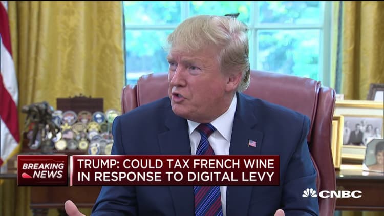 Breaking: President Trump responds to France's tax on American companies, might impose wine tax