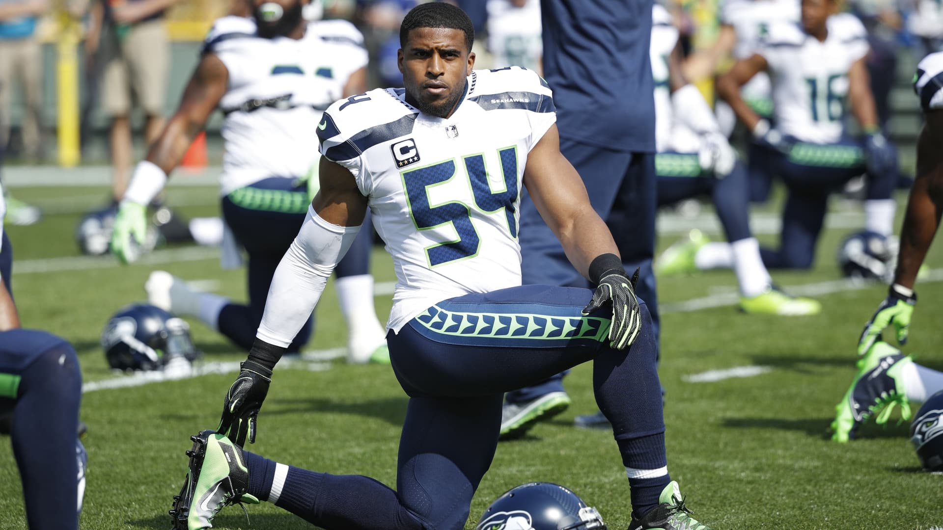 Bobby Wagner #54 of the Seattle Seahawks stretches before a game against the Green Bay Packers at Lambeau Field on September 10, 2017 in Green Bay, Wisconsin.