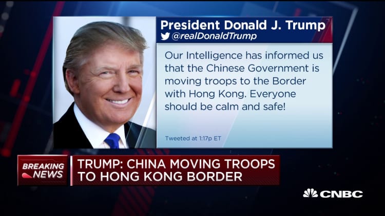 Trump tweets that China's moving troops to Hong Kong border