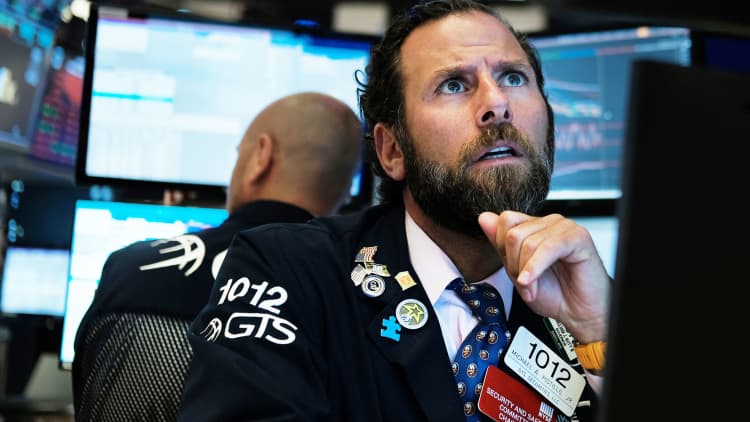 Dow closes 300 points higher after wild week