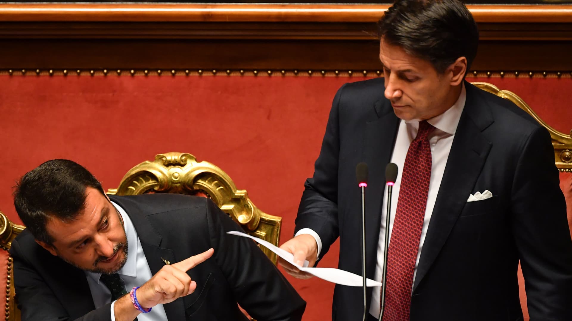 Italian Prime Minister Giuseppe Conte (R), flanked by Deputy Prime Minister and Interior Minister Matteo Salvini (L), delivers a speech at the Italian Senate, in Rome, on August 20, 2019, as the country faces a political crisis.