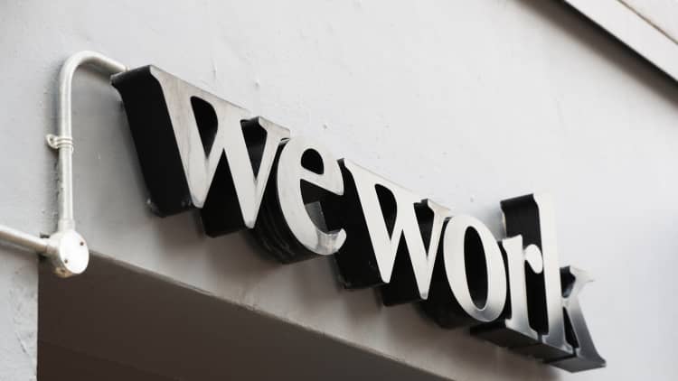 Softbank urges WeWork to put off its IPO