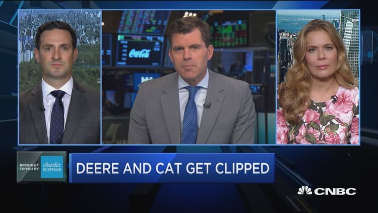 These investing pros make the case for Deere and Caterpillar