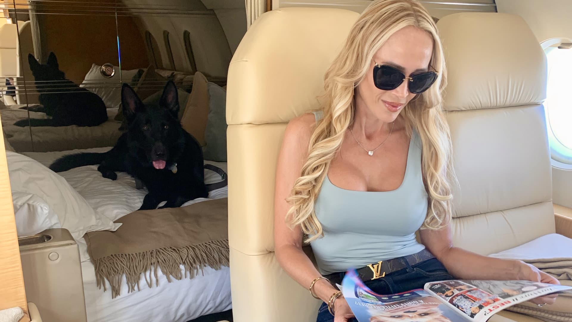Bentley in a private jet with her protection canine Valdemar.