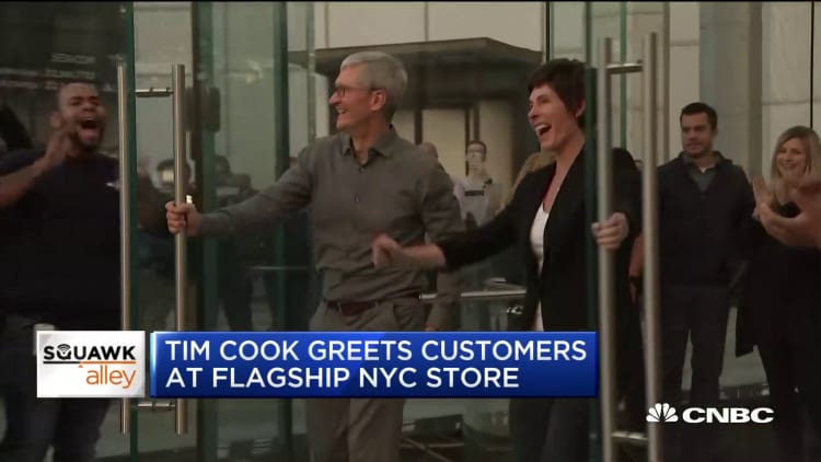 Apple CEO Tim Cook greets customers at renovated New York Apple Store