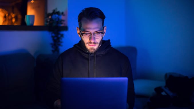 Getty: Man using laptop, hacking