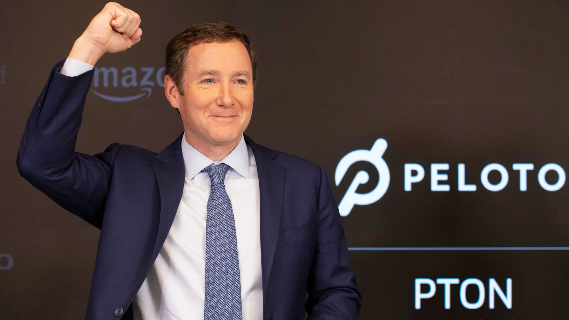 Peloton CEO John Foley celebrates at the Nasdaq MarketSite before the opening bell and his company's IPO, Thursday, Sept. 26, 2019 in New York.