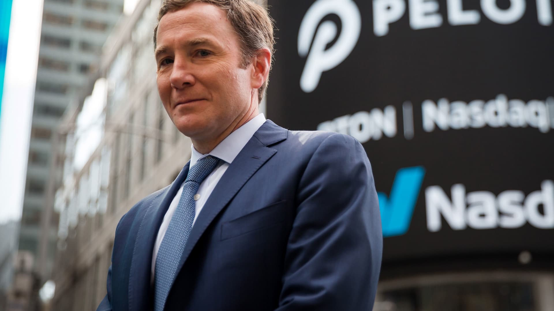 John Foley, co-founder and chief executive officer of Peloton Interactive Inc., stands for a photograph during the company's initial public offering (IPO) in front of the Nasdaq MarketSite in New York, on Thursday, Sept. 26, 2019.