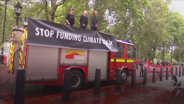 Climate change activists spray red liquid at UK Treasury building