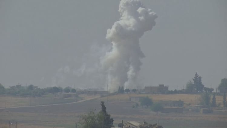 Explosions rock Syrian border towns as Turkey begins offensive