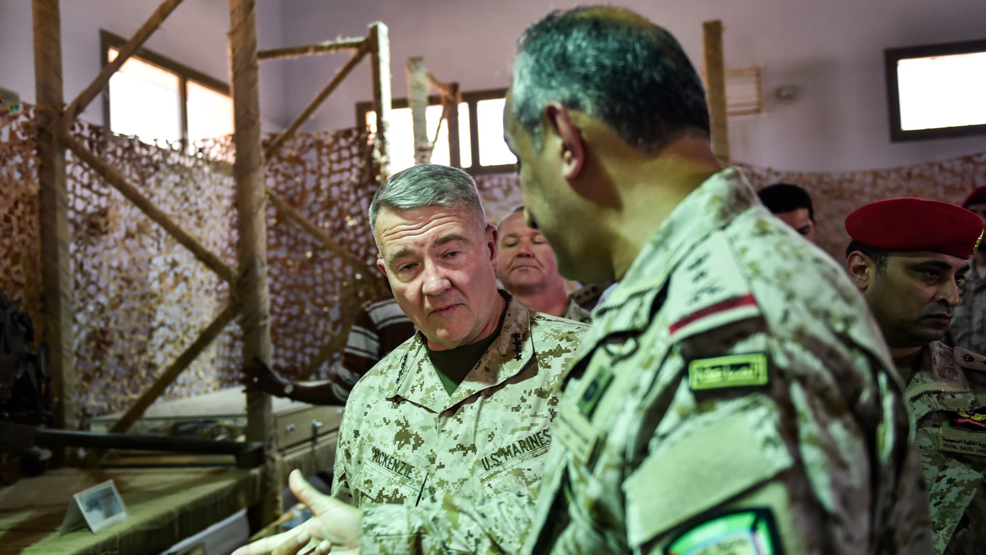 US Marine Corps General Kenneth F. McKenzie Jr. (C, behind), commander of the US Central Command (CENTCOM) and Lieutenant General Fahd bin Turki bin Abdulaziz al-Saud (front), commander of the Saudi-led coalition forces in Yemen, are shown reportedly Iranian weapons seized by Saudi forces from Yemen's Huthi rebels, during his visit to a military base in al-Kharj in central Saudi Arabia on July 18, 2019.