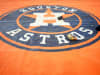 A detail shot of the Houston Astros logo on the tarp on the field during batting practice prior to Game 2 of the ALDS between the Tampa Bay Rays and the Houston Astros at Minute Maid Park on Saturday, October 5, 2019 in Houston, Texas. (Photo by Cooper Neill/MLB Photos via Getty Images)