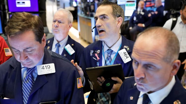 Stocks drop and bond yields rise after Fed cuts rates for third time since July