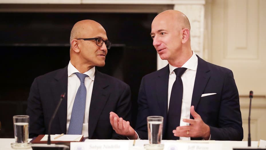 Microsoft CEO Satya Nadella (L) and Amazon CEO Jeff Bezos visit before a meeting of the White House American Technology Council in the State Dining Room of the White House June 19, 2017 in Washington, DC.
