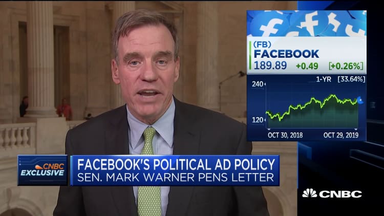 Sen. Warner: Facebook's ad policy allows politicians to 'lie with impunity'
