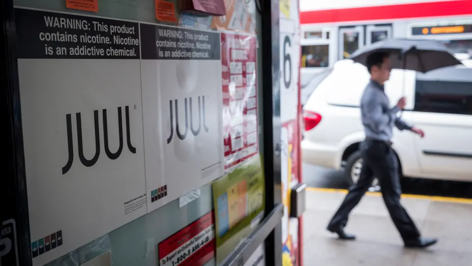 Juul Labs signage is seen in the window of a store in San Francisco, June 25, 2019.