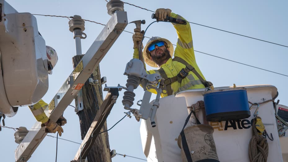 Workers for Source Power Services, contracted by Pacific Gas & Electric (PG&E), repair a power transformer in Healdsburg, California, on Thursday, Oct. 31, 2019.