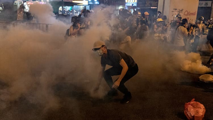 Hong Kong protests spiral after man is shot, another set on fire