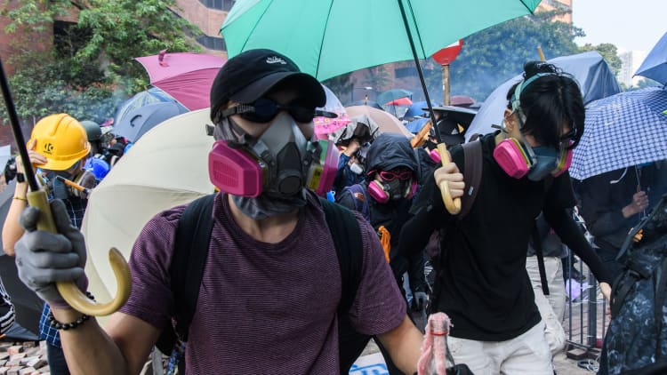 Beijing attacks Hong Kong ruling to overturn face mask ban