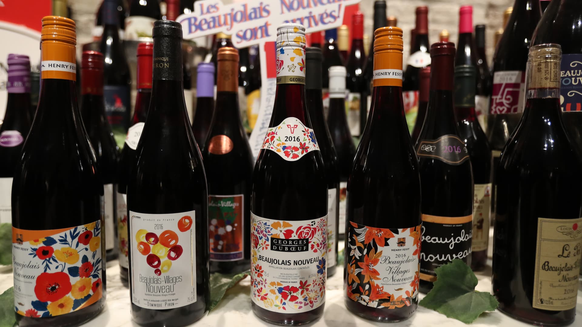 Bottles of the 2016 vintage Beaujolais Nouveau wine are displayed at a countdown event in Tokyo on November 17, 2016.