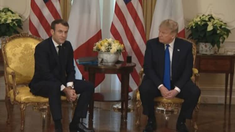 Trump denounces Macron's NATO comments ahead of meeting