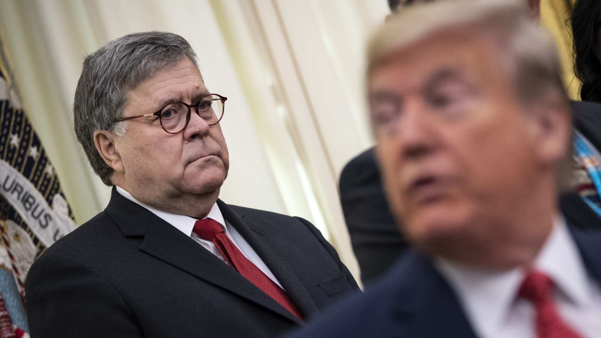 U.S. Attorney General William Barr and U.S. President Donald Trump attend a signing ceremony for an executive order in the Oval Office of the White House on November 26, 2019 in Washington, DC.